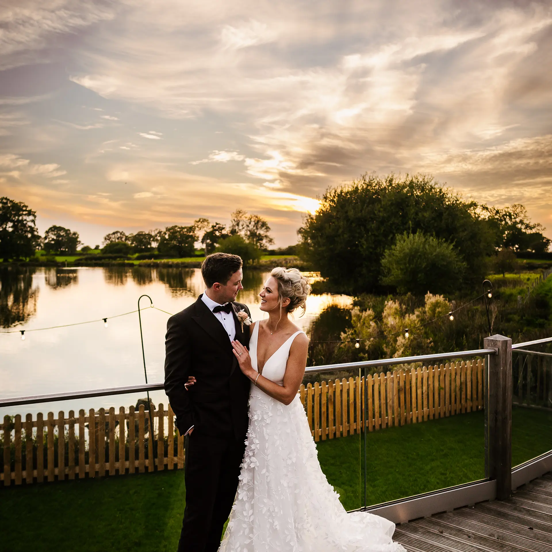sandhole-oak-barn-bride and groom by the lake evening